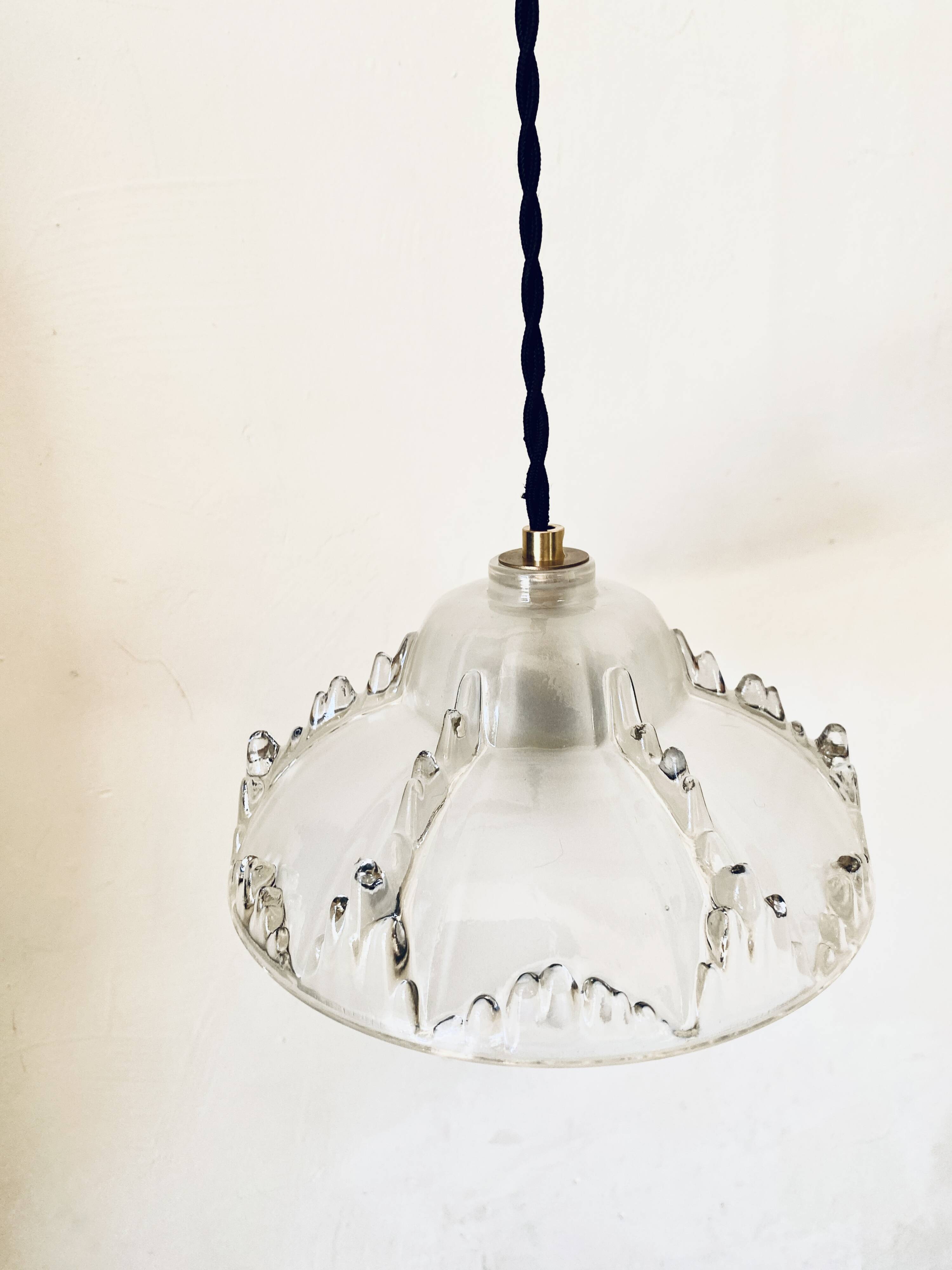 Glass pendant light, braided fabric cable and porcelain ceiling rose