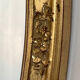Oval mirror in carved wood