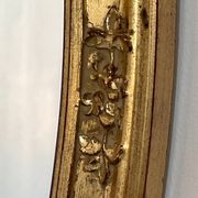 Oval mirror in carved wood