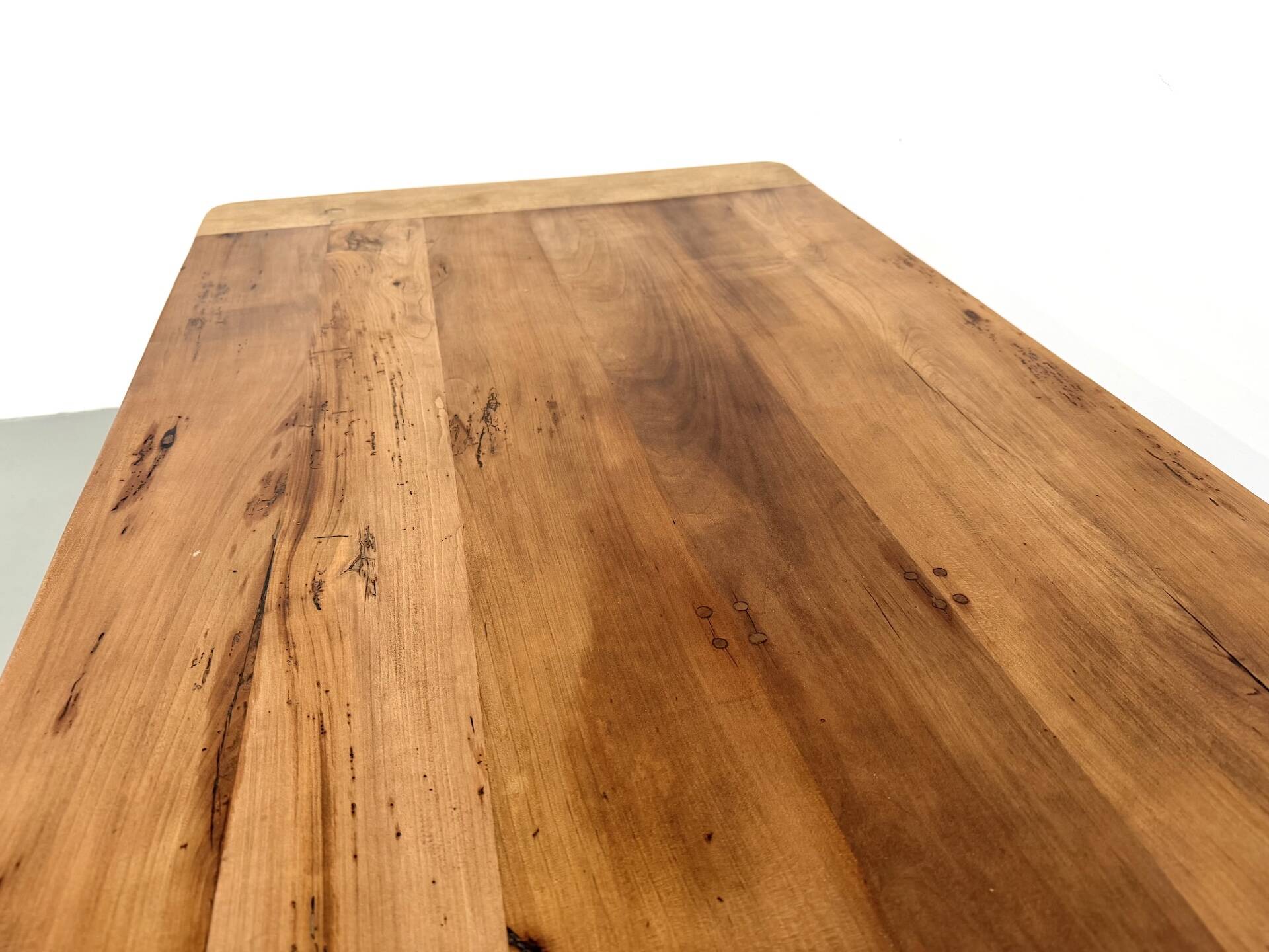 Farm table in solid cherry — Saber legs, Circa 1880