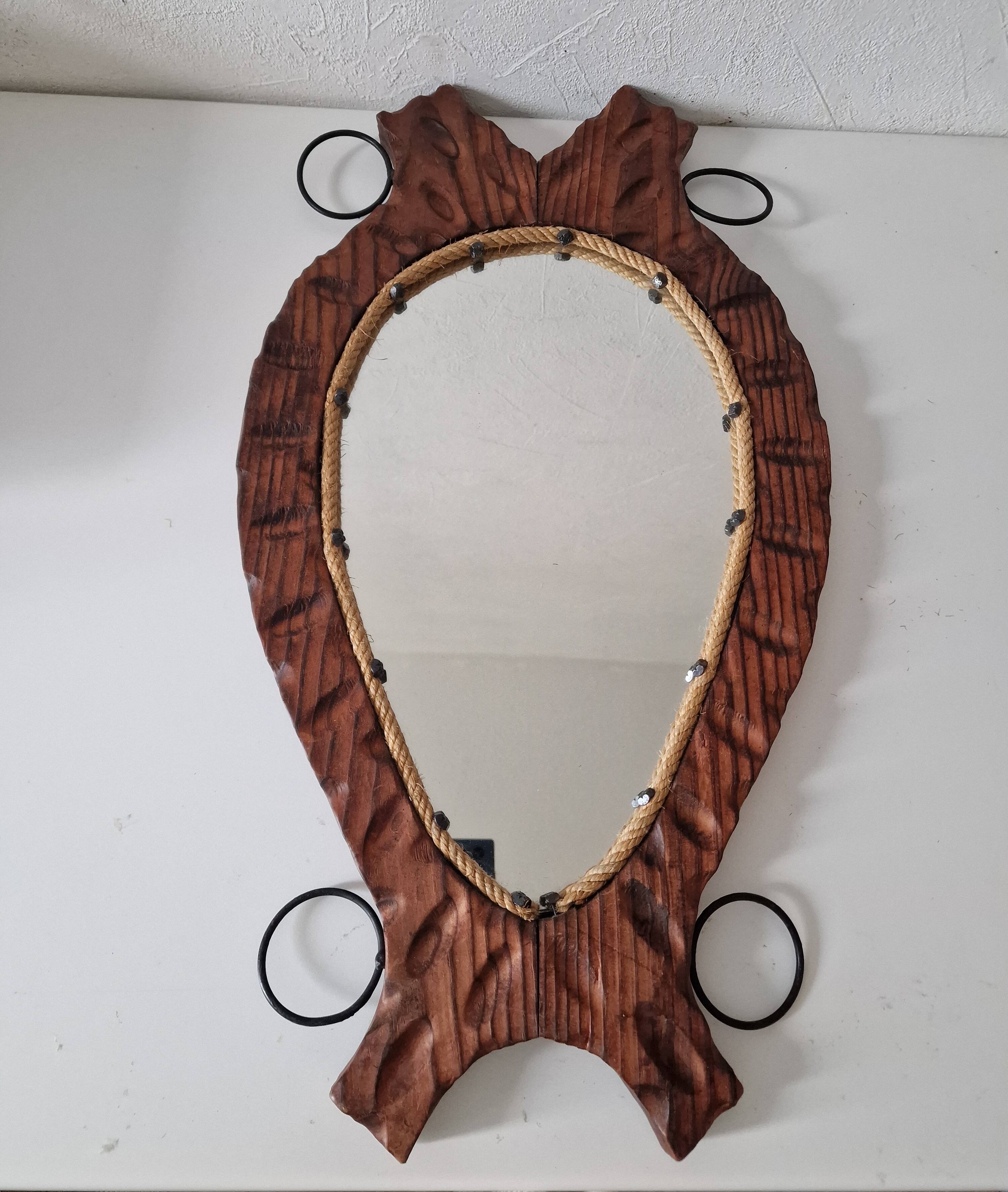 Brutalist mirror in wood and rope, free form.