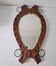 Brutalist mirror in wood and rope, free form.