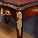 Rosewood, mahogany, and rosewood desk-table, Louis XV style – early 20th century.