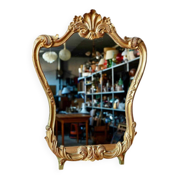 Baroque gold table mirror in Louis XV style, carved and stuccoed wood.