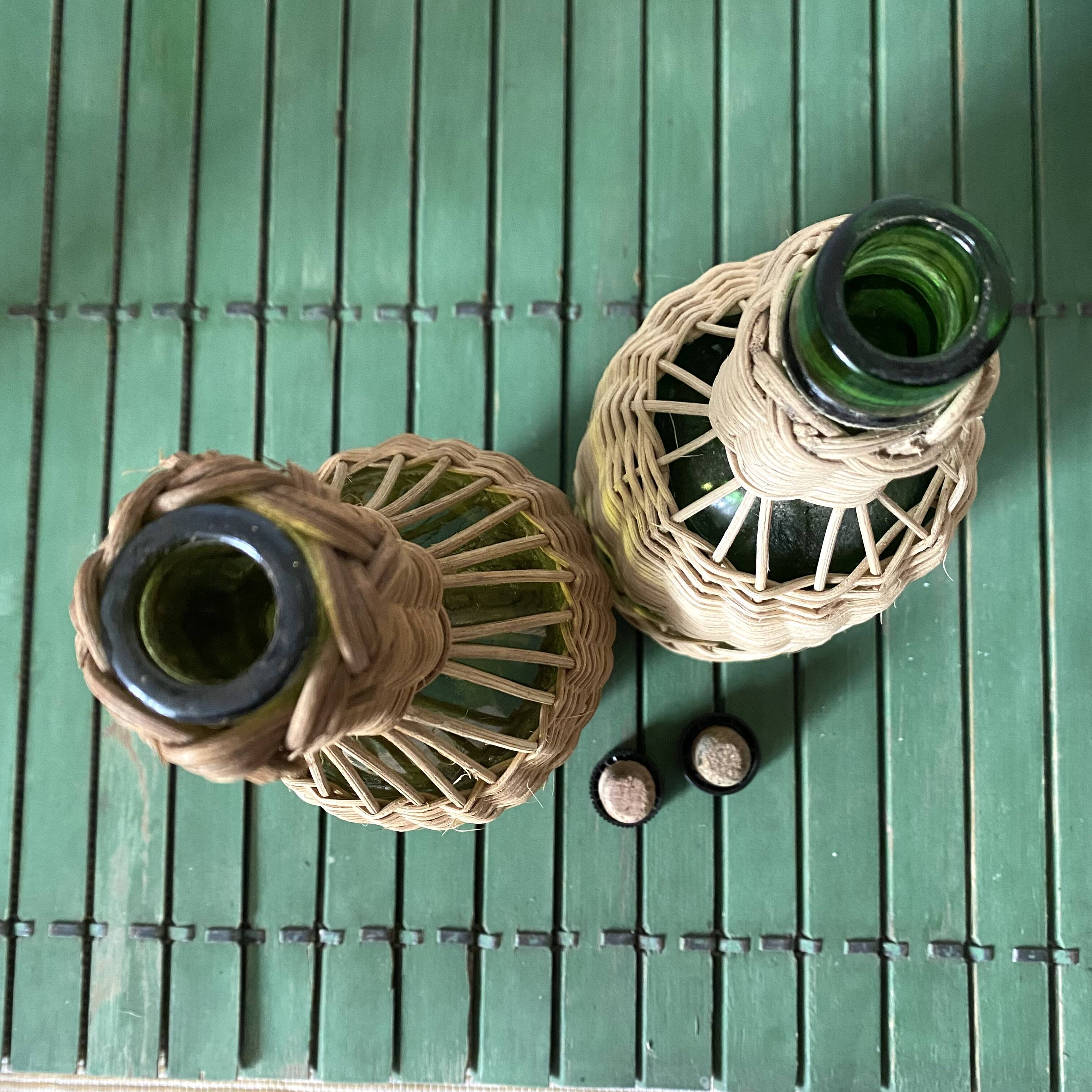 Glass bottles and woven rattan