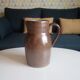 Vintage pitcher in glazed sandstone