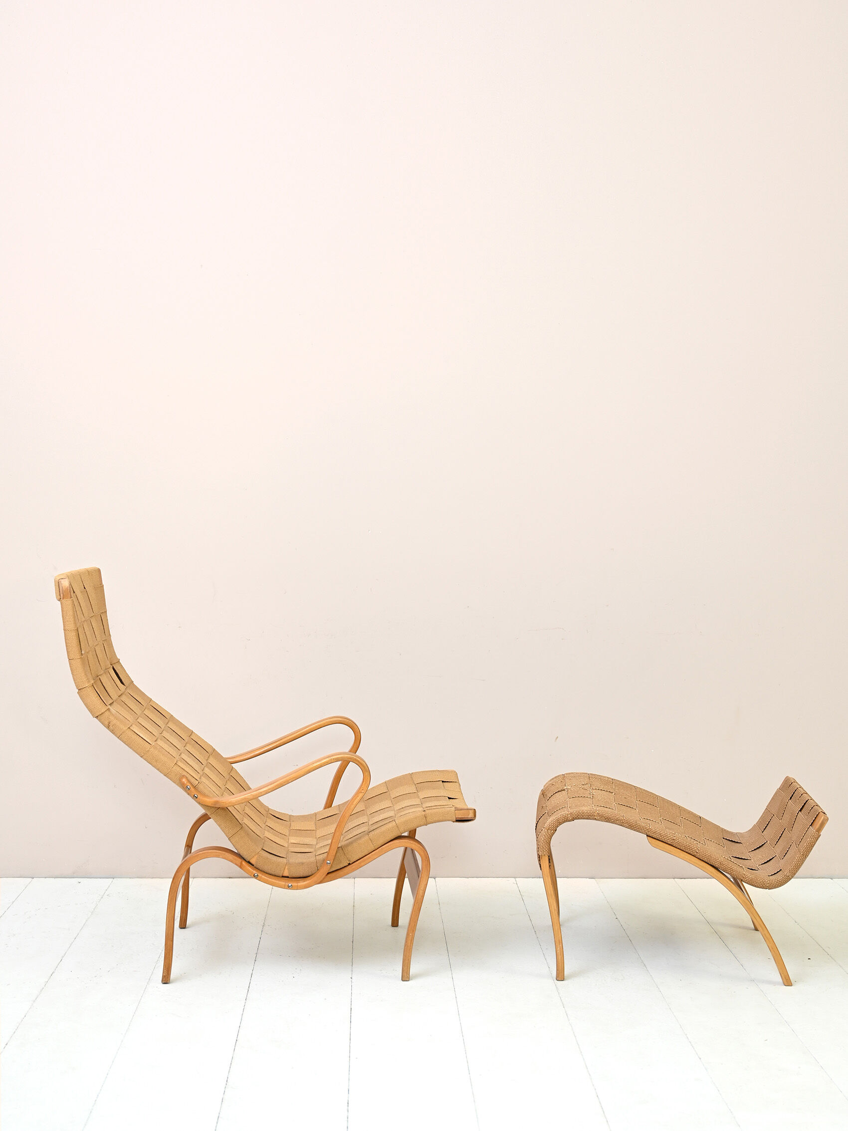 'Pernilla' armchair and footstool designed by Bruno Mathsson