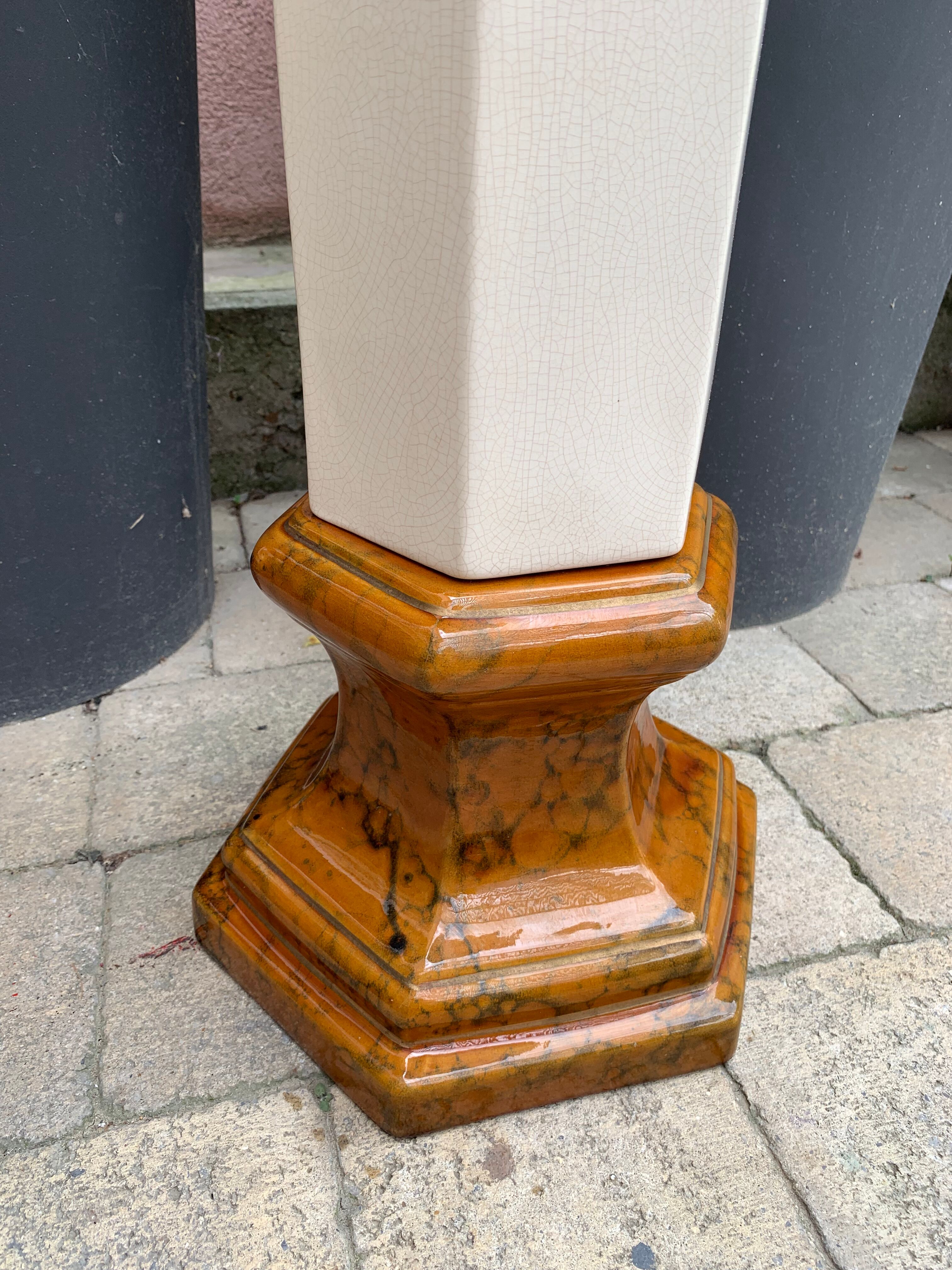 Column wears vintage plant