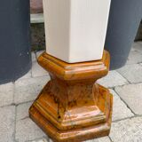 Column wears vintage plant