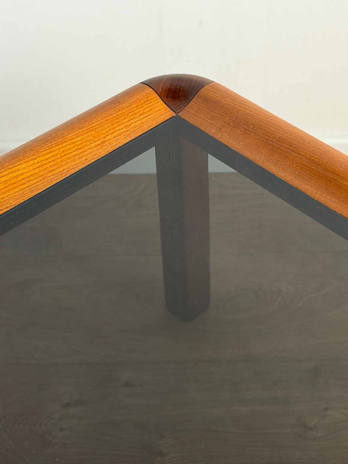 Square wooden coffee table with glass.