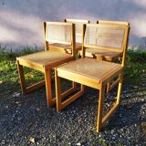 Four trendy tanned wooden chairs
