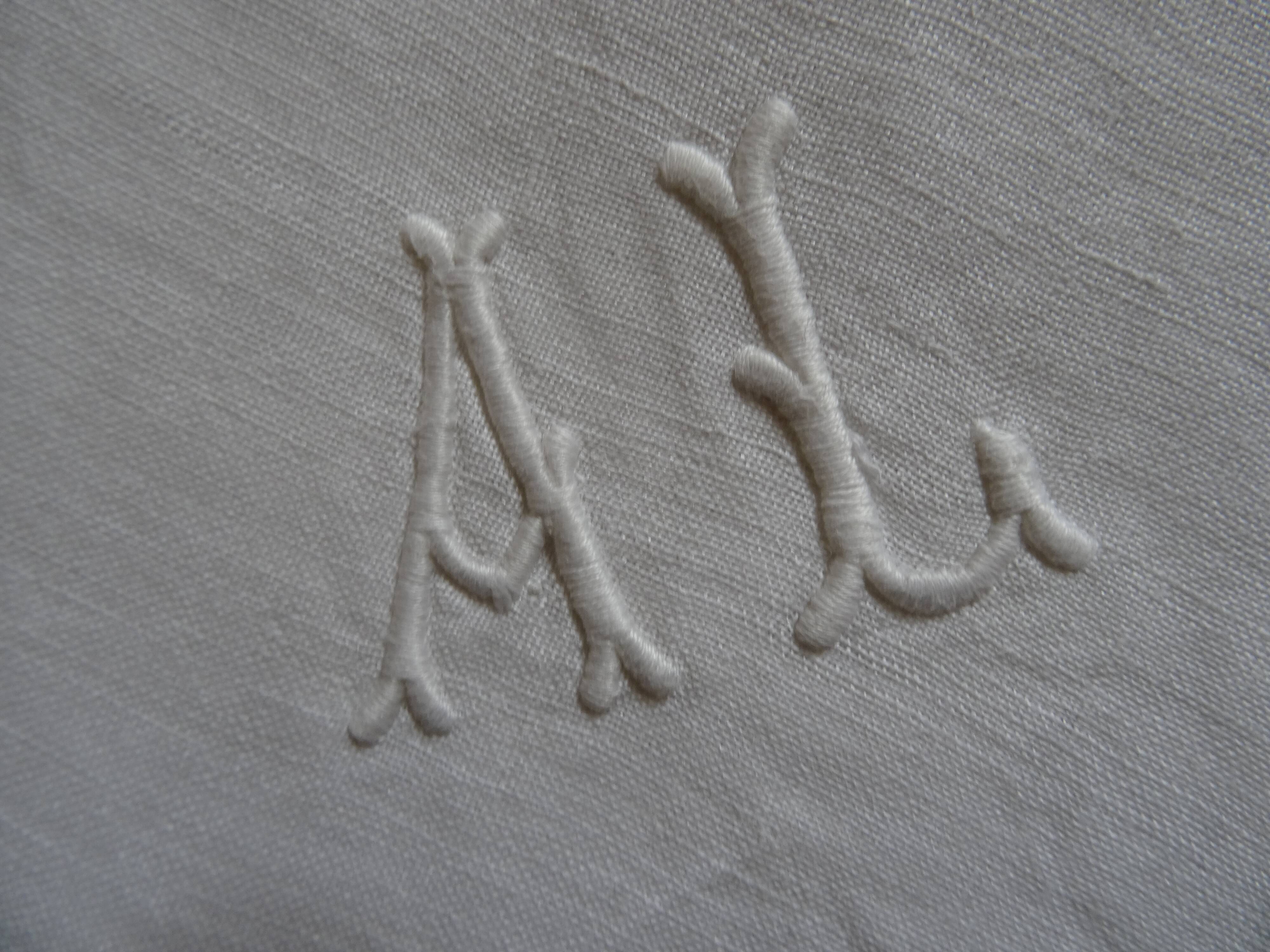 Pair of AL monogrammed pillowcases