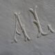 Pair of AL monogrammed pillowcases