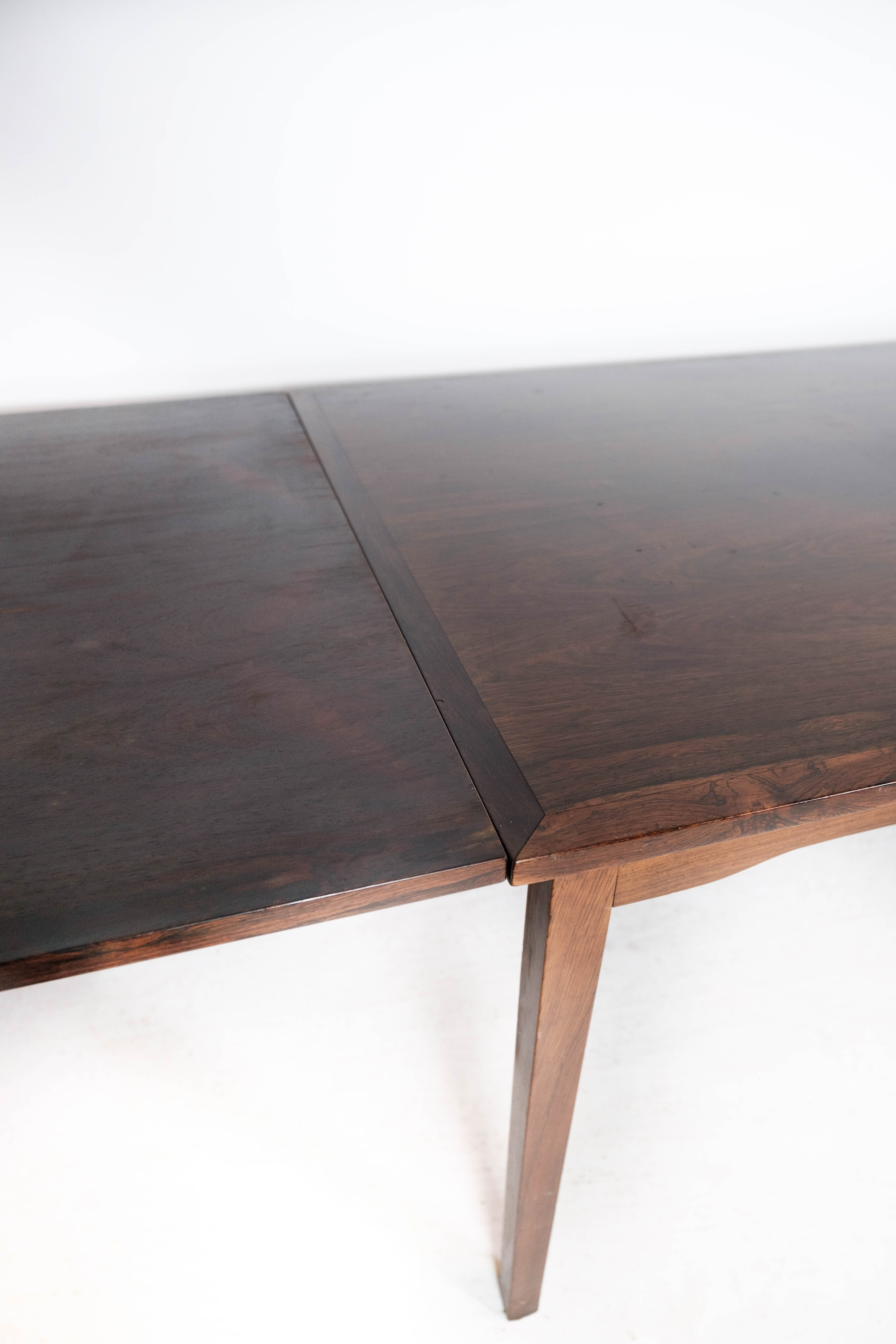 Dining table in rosewood with extension, of Danish design by Ellegaards Furniture, 1960s