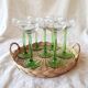 Lot of 7 champagne glasses from the 1970s and a vintage wicker and glass tray.