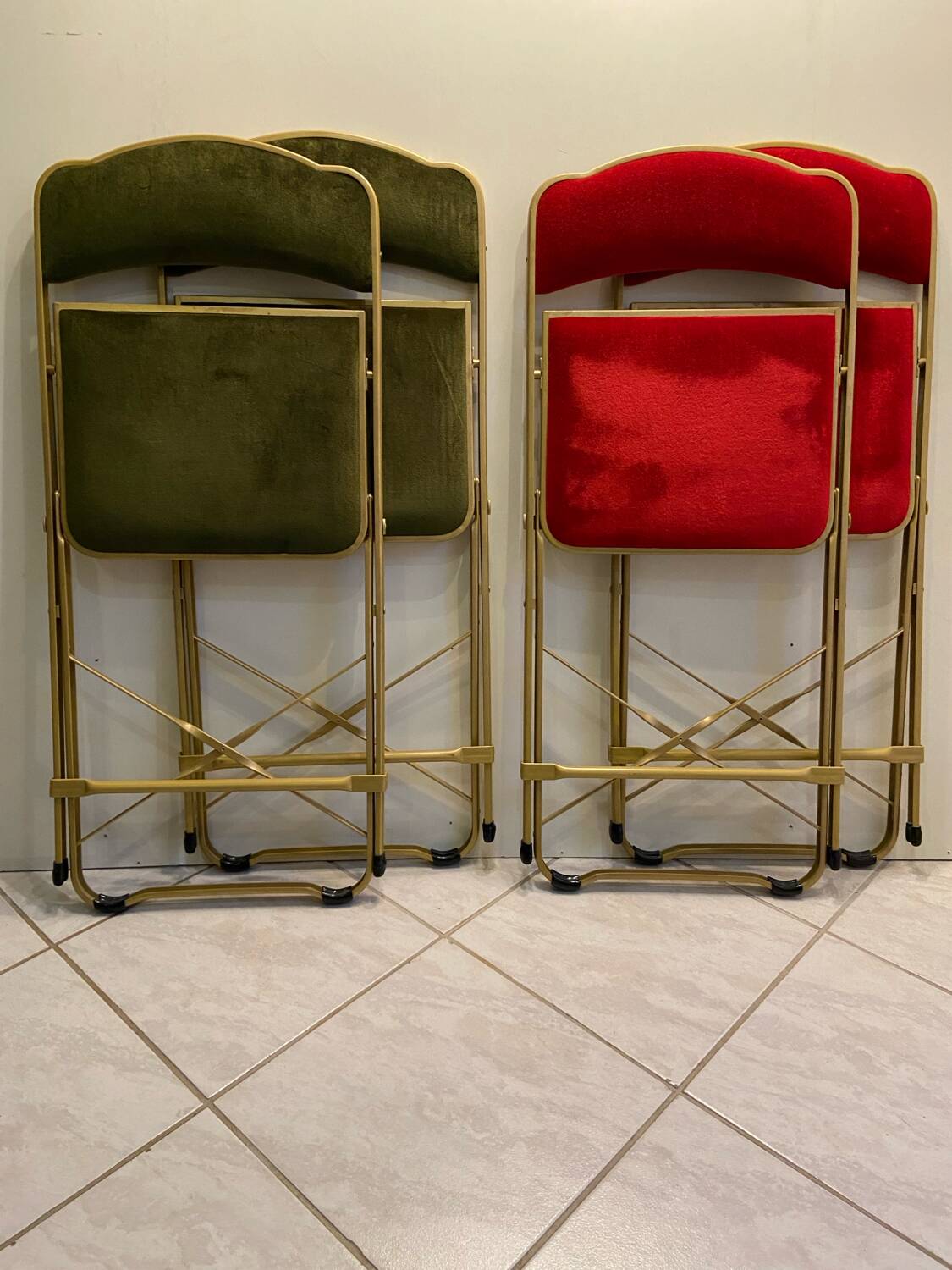 Velvet folding chair with gold metal.