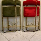 Velvet folding chair with gold metal.
