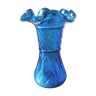 Blue glass vase with corolla