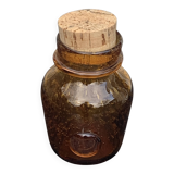 Blown and bubbled glass jar in the style of Biot glassworks, amber color