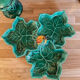 Old dish in green slip decor 3 vine leaves and an apple