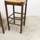 Pair of 80 cm high straw and beech bar stools