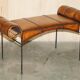 Vintage Spanish window bench in hand-stitched leather and restored iron.