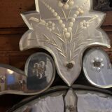 Oval Venetian mirror with close-bezel, early 20th century, flower decoration