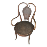 Antique curved wooden armchair with caning – Bistro style