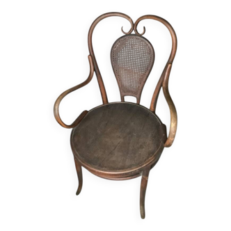Antique curved wooden armchair with caning – Bistro style