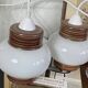 Pair of pendant lights with white glass shades from the 1950s.