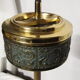 Gold metal standing ashtray and black marble base