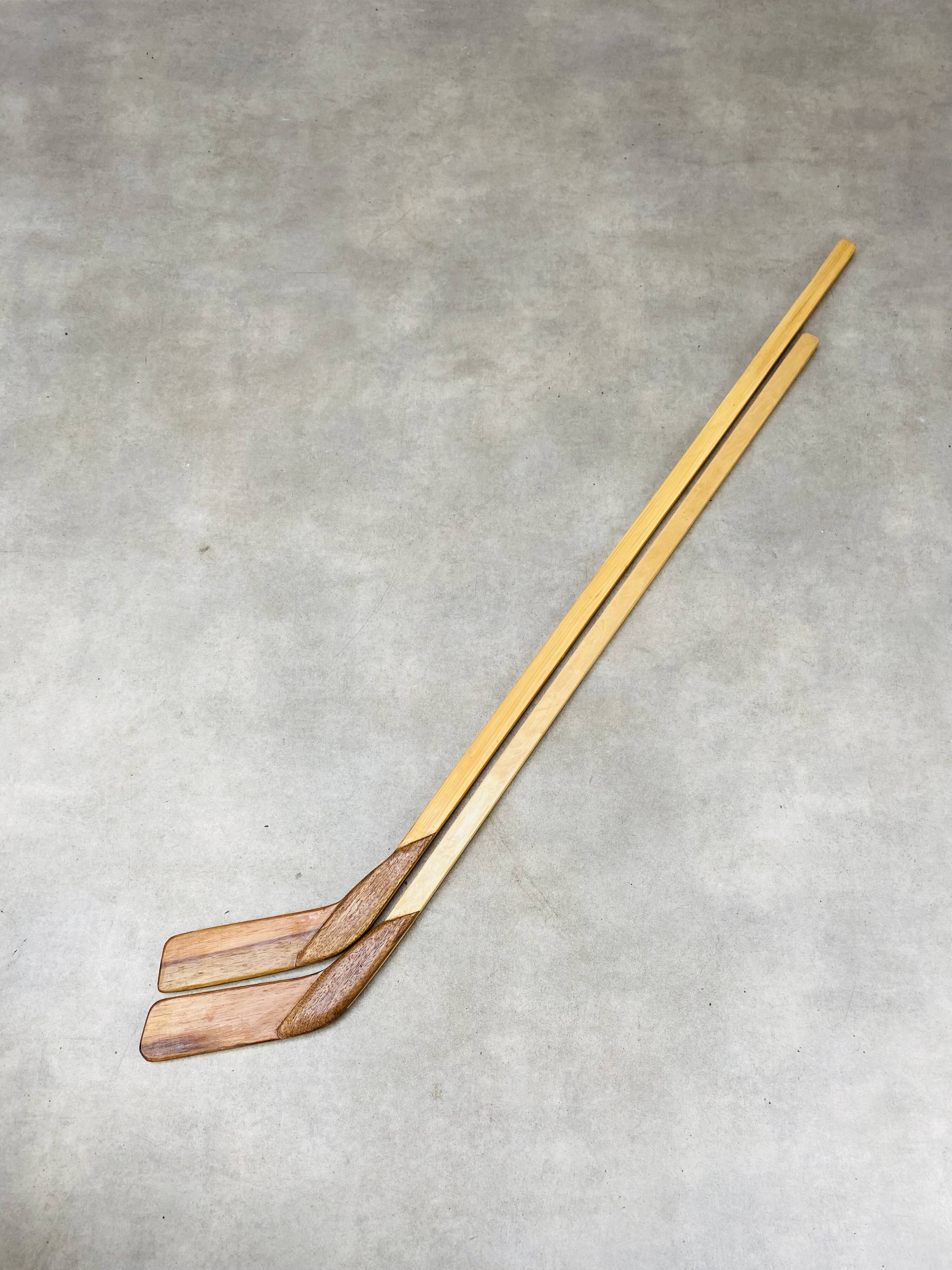 Pair of vintage wood hockey sticks