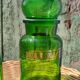 Duo of pots and jars apothecary style in green glass.