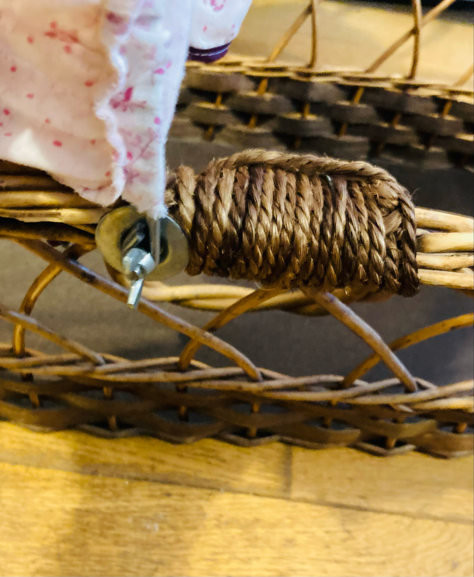 1960s wicker cradle with mattress and drapes.