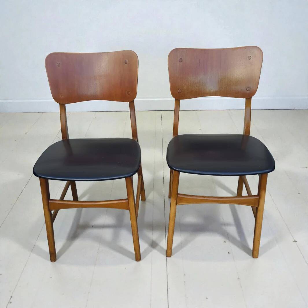Set of 2 vintage Scandinavian chairs in teak and black faux leather by Kofod-Larsen, Denmark, 1960s.