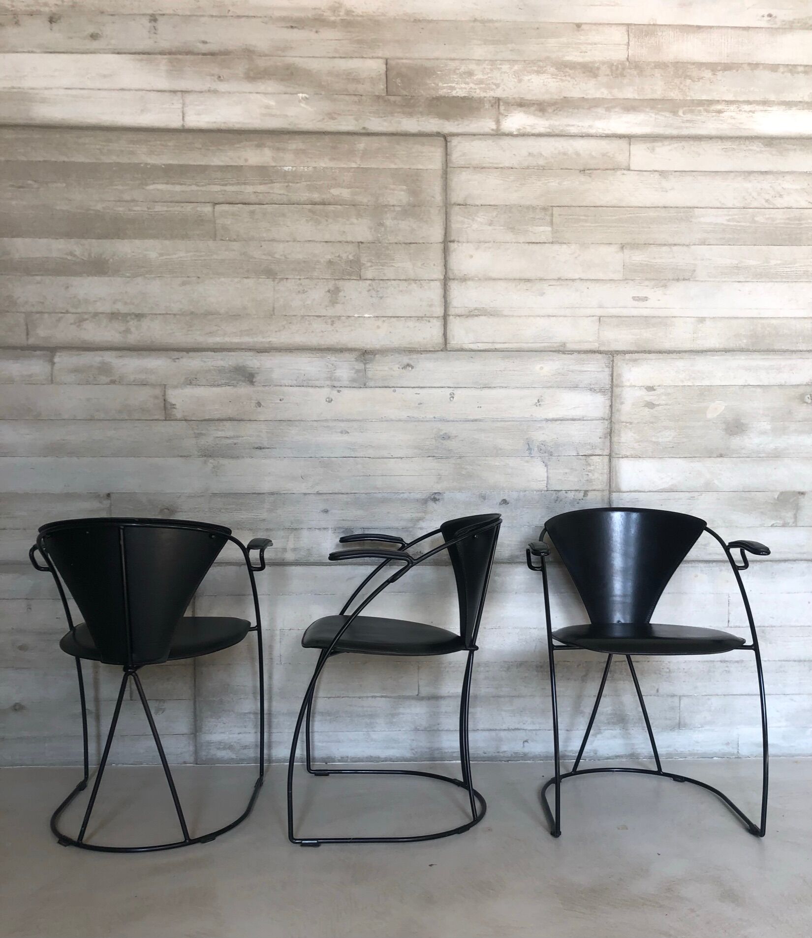 “Armlinda” black leather dining chairs by Arrben Italy