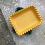 Two dishes, one green and one yellow
