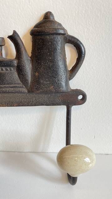 Coat rack made of steel and porcelain