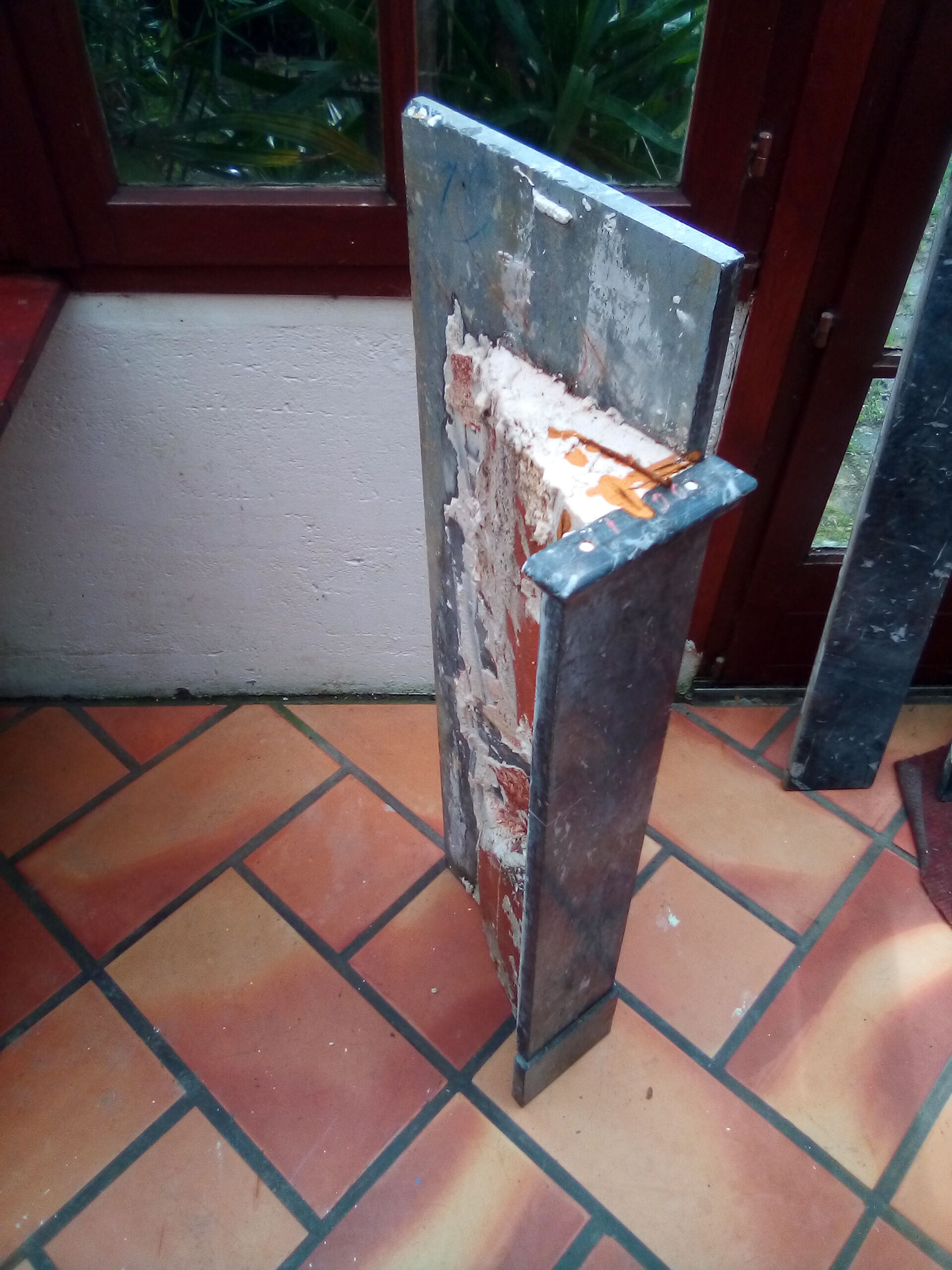 White veined black marble fireplace