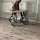 Table basse en fer forgé et marbre beige vers 1930