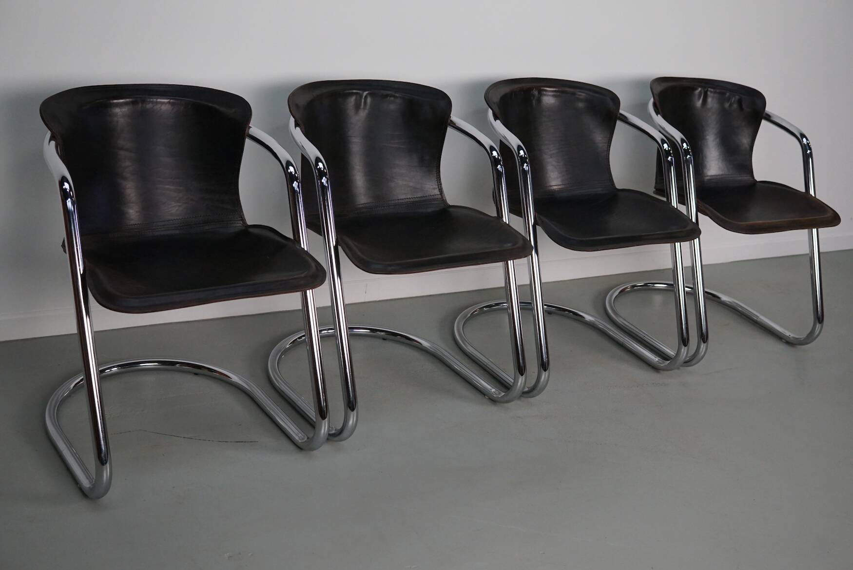 Set of four brown leather dining chairs, Willy Rizzo, 1970