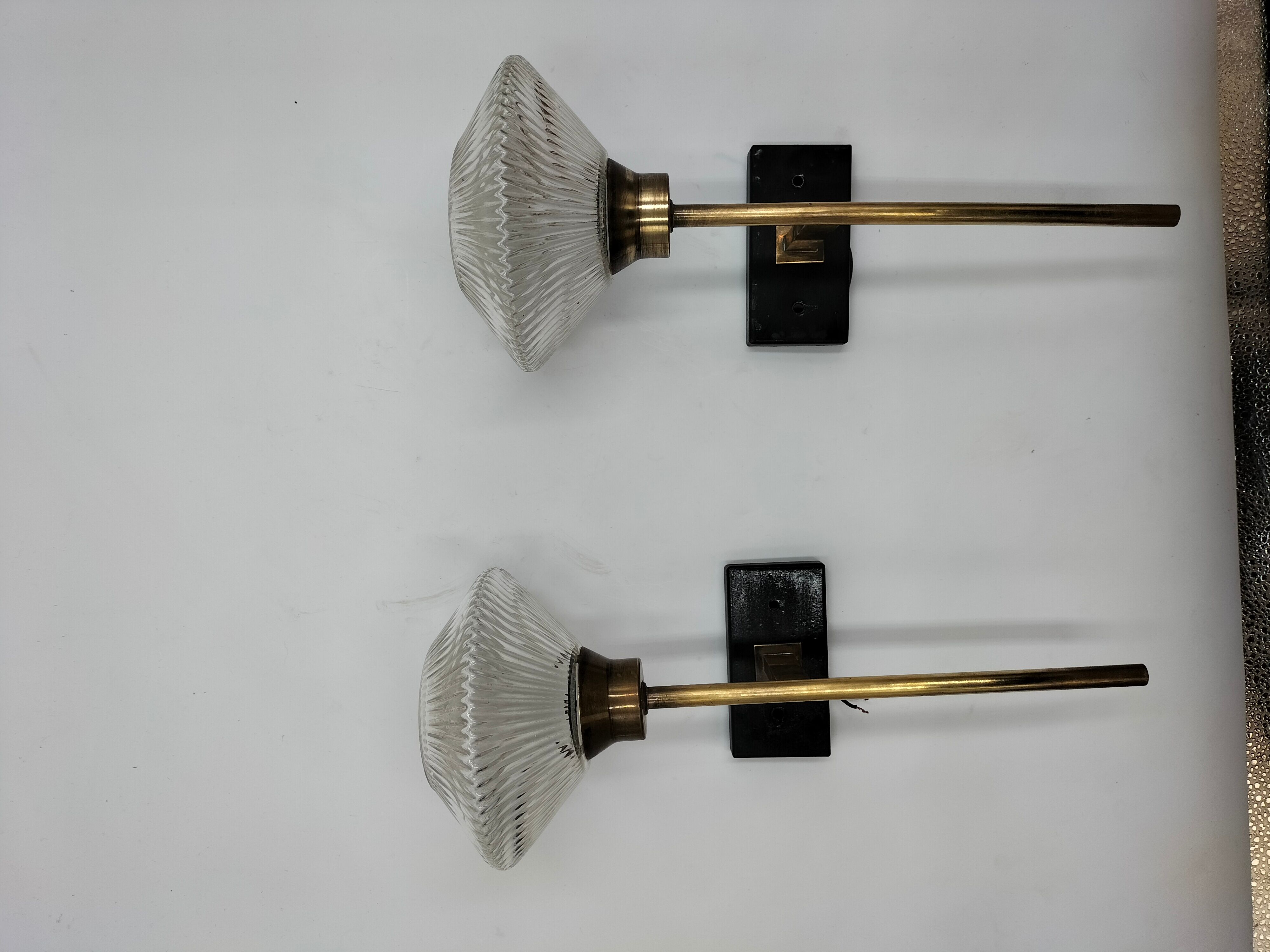 Pair of brass and glass wall lamps