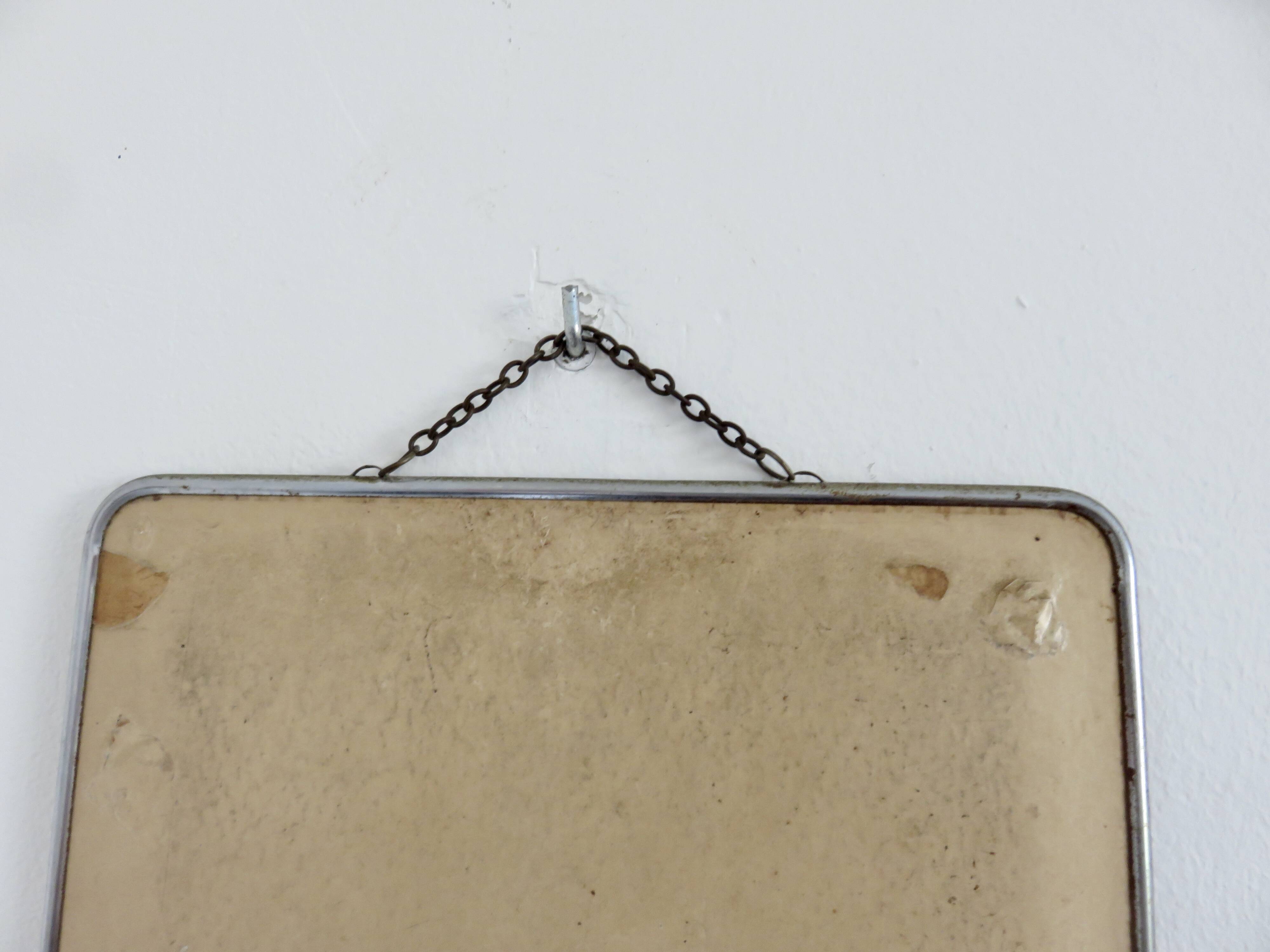 Old barber's mirror with chain, 1950s and 1960s