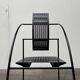 Postmodern black Quinta chair in perforated metal by Mario Botta for Alias, 1980s.