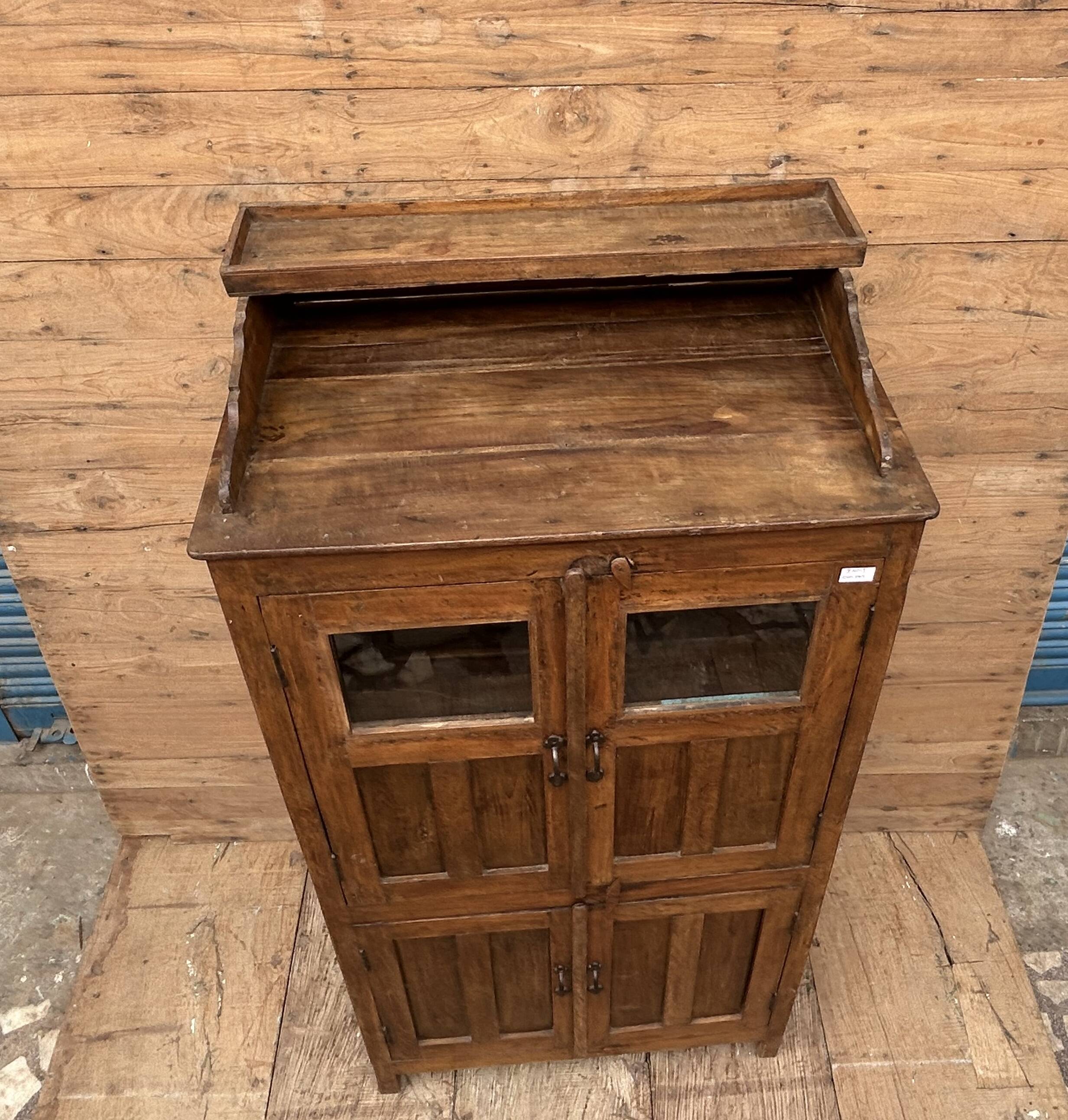 Art Deco glass-fronted cabinet in Burmese teak with original patina.