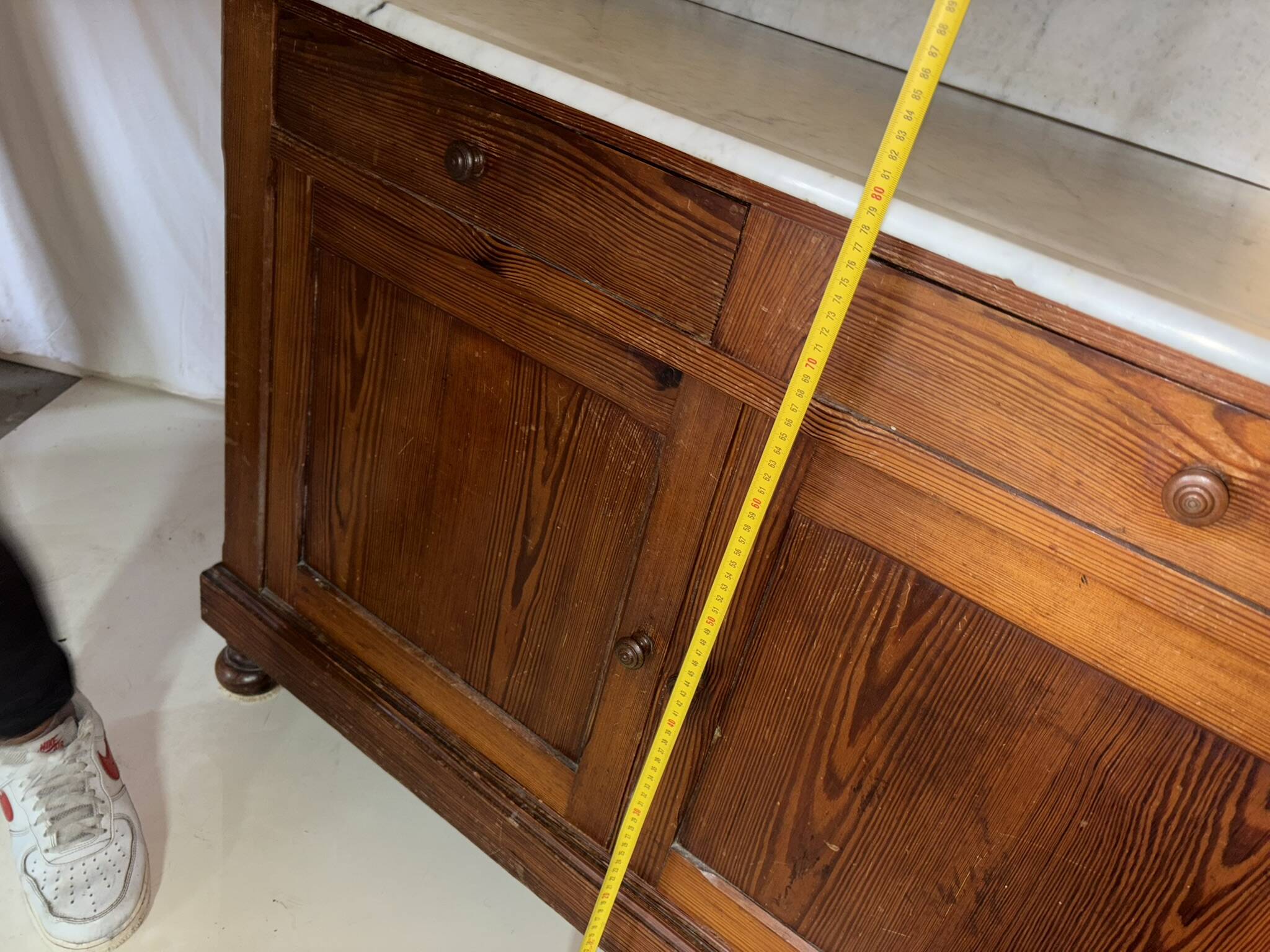 Antique wood and marble kitchen sideboard with carved backsplash