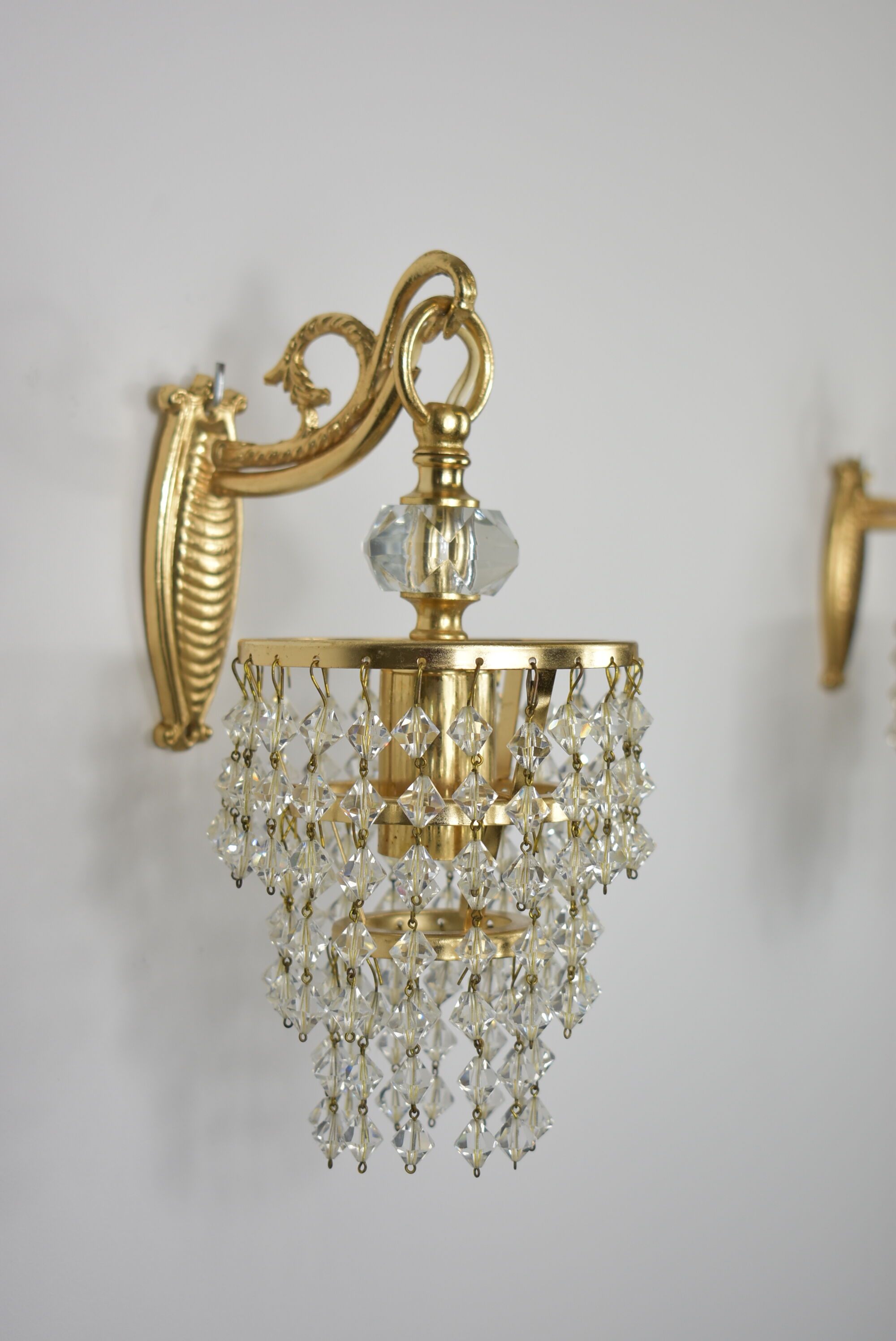 Pair of gold wall light with stamps