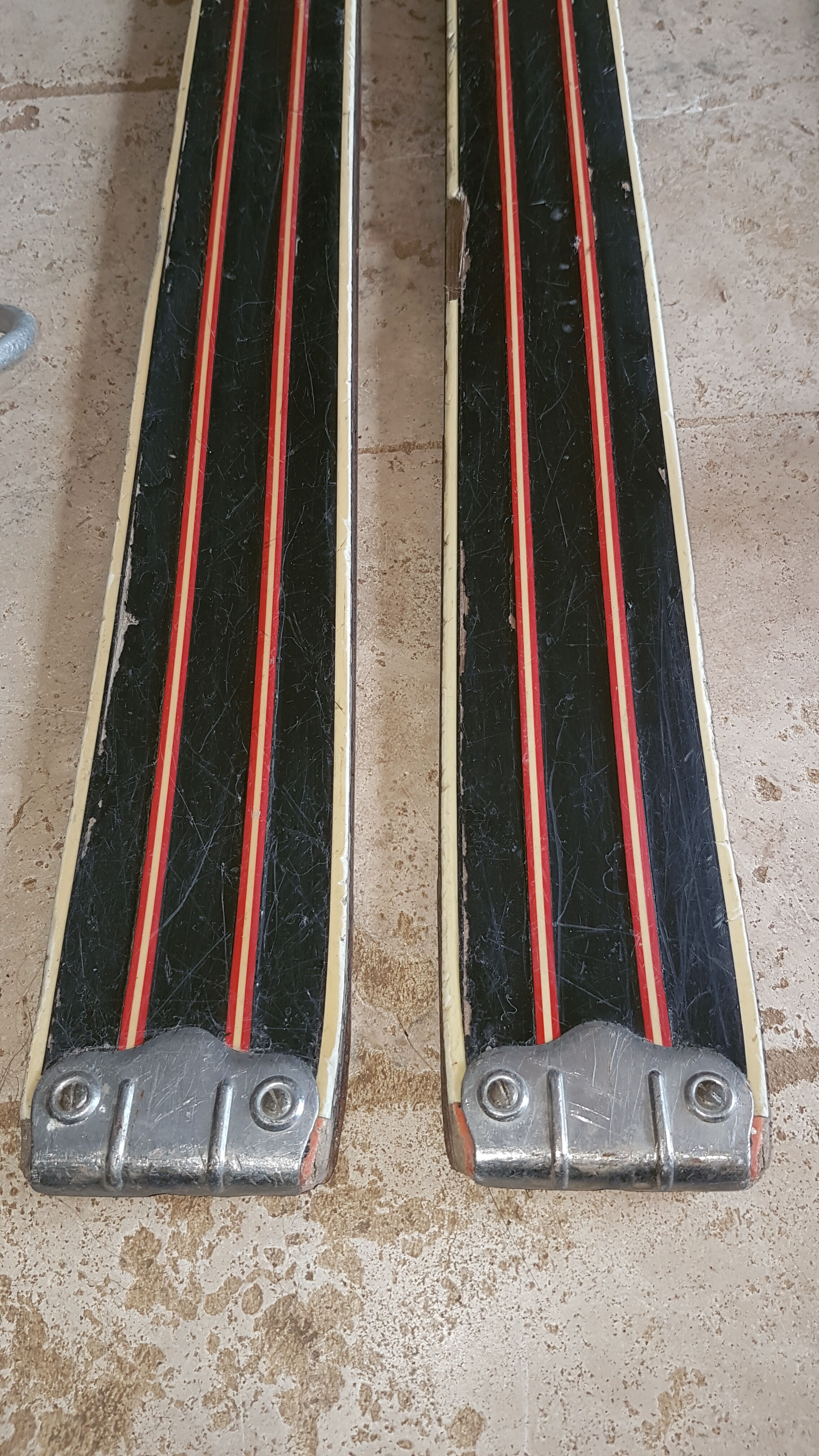 Old skis wooden and its pair of sticks