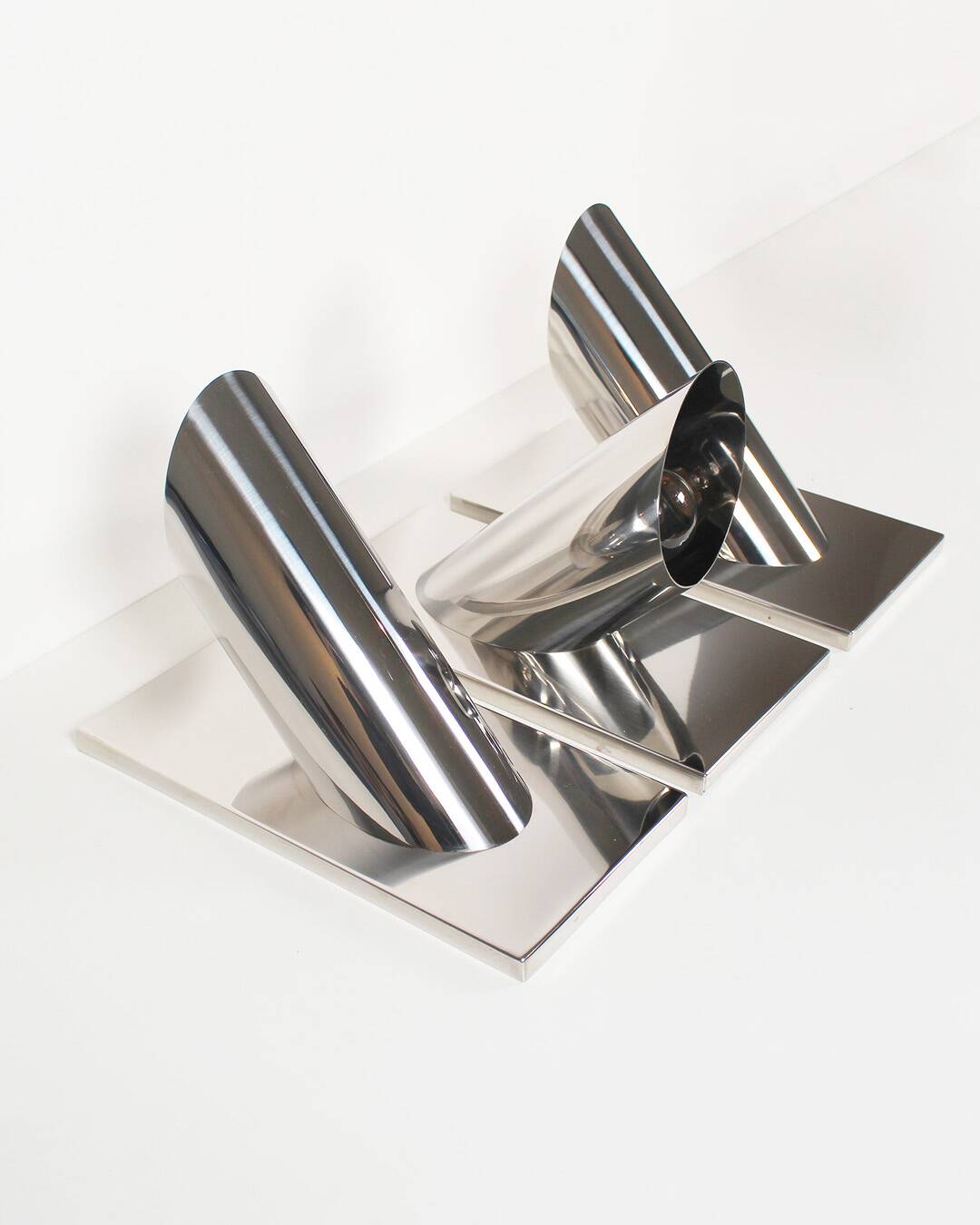 Set of three large sculptural vintage chrome metal wall lights