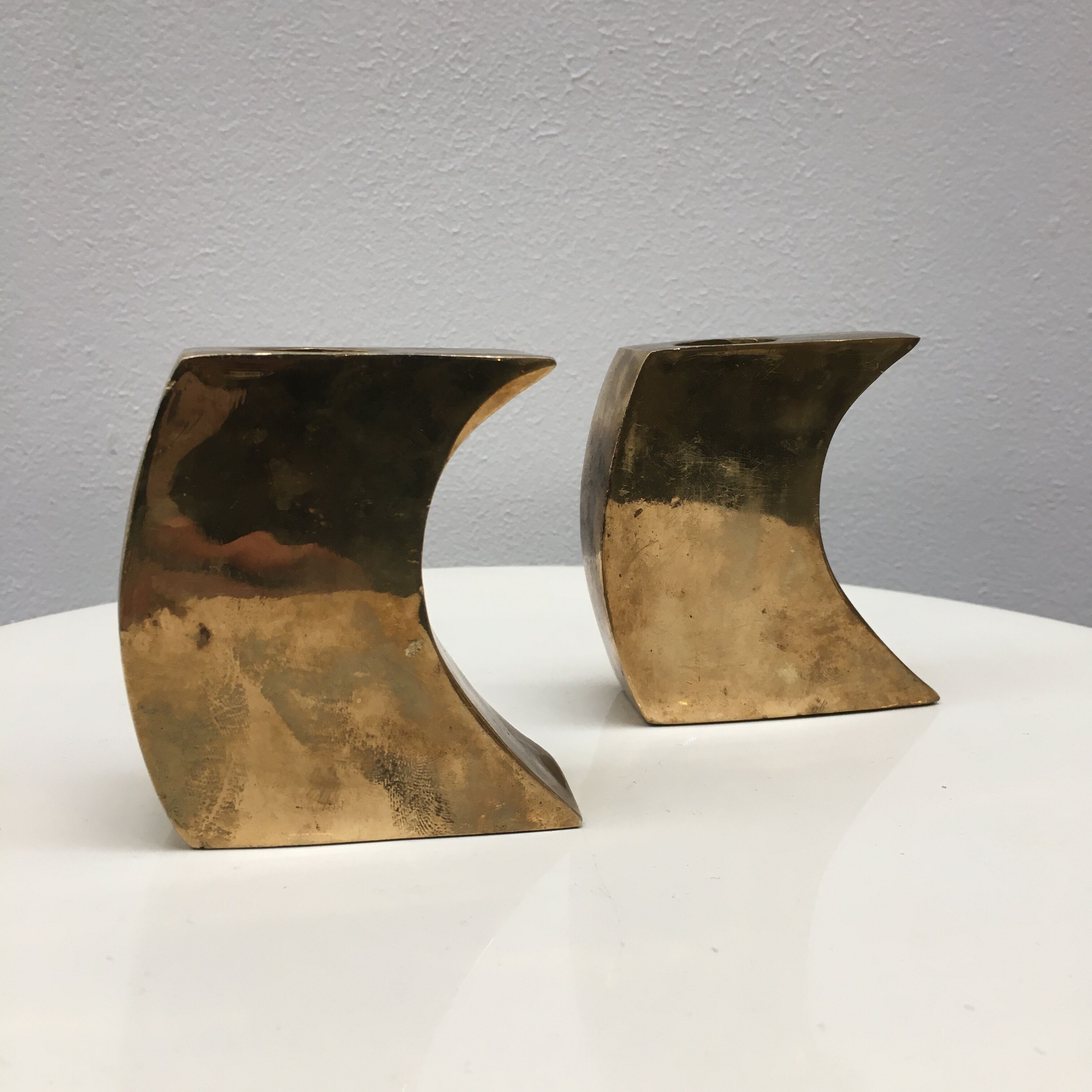 Pair of bronze candle holders by Monique Gerber